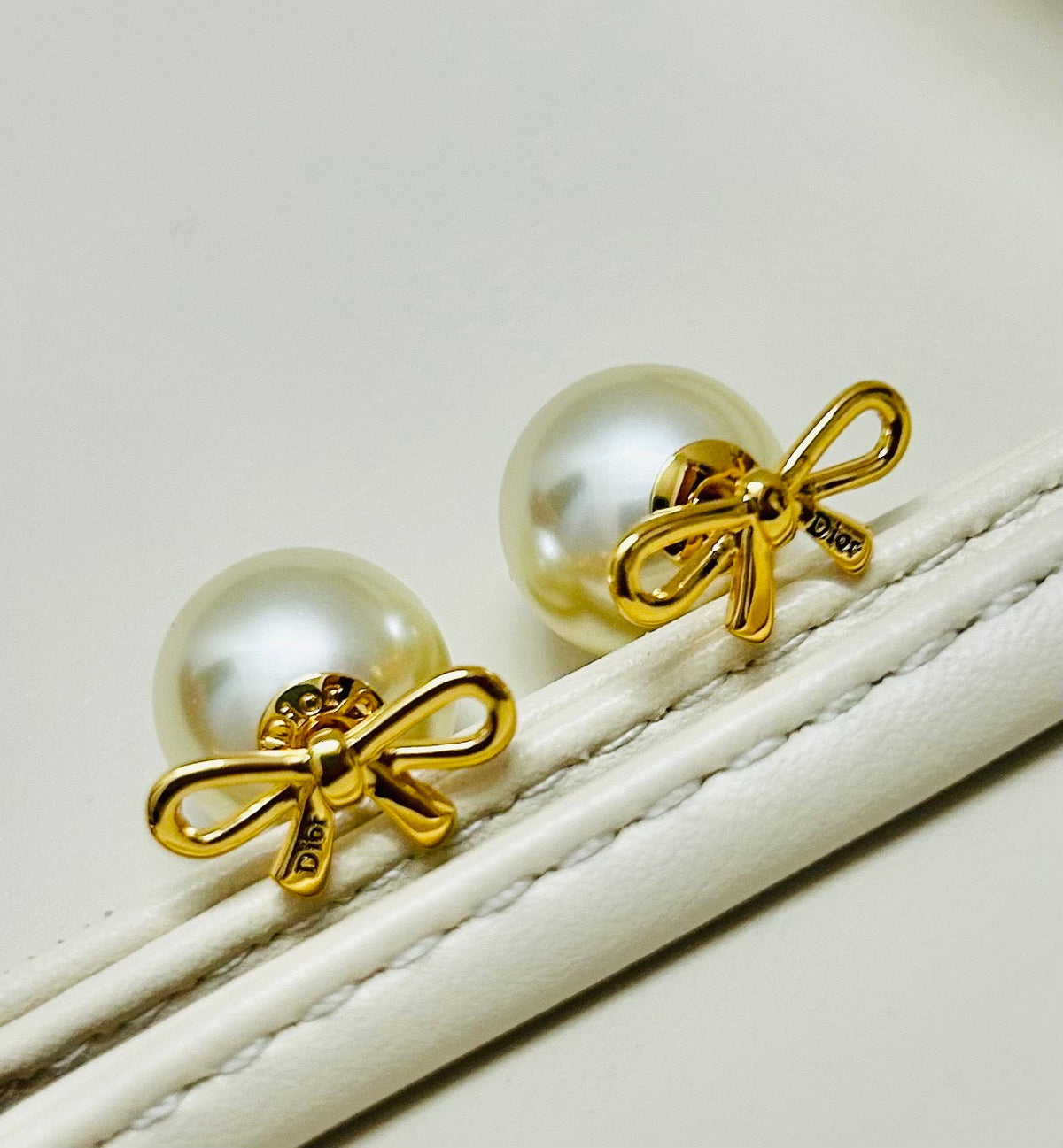 Martin Graham earrings in polished metal-tone – close-up detail