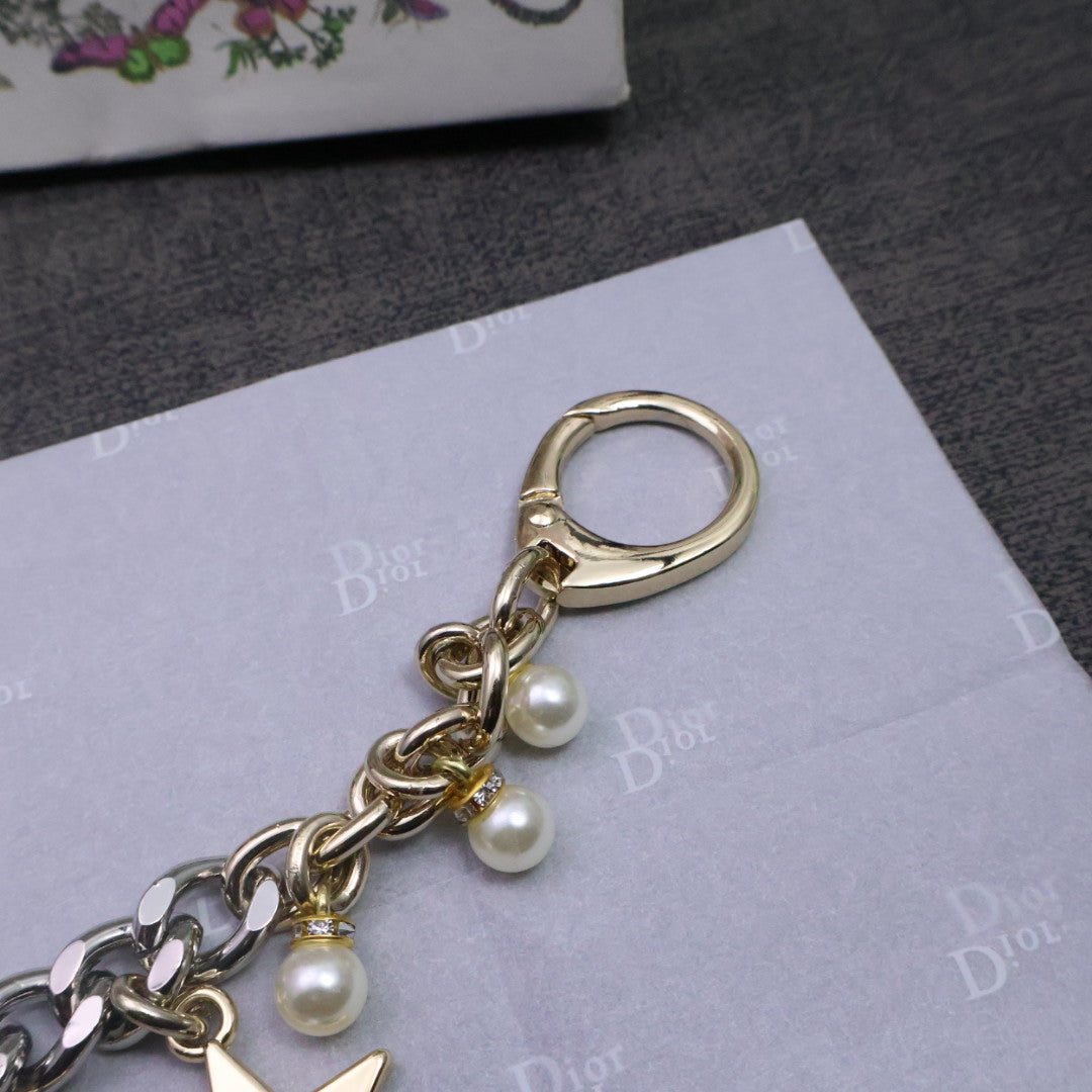 Martin Graham jewelry accessory in polished metal-tone – close-up detail