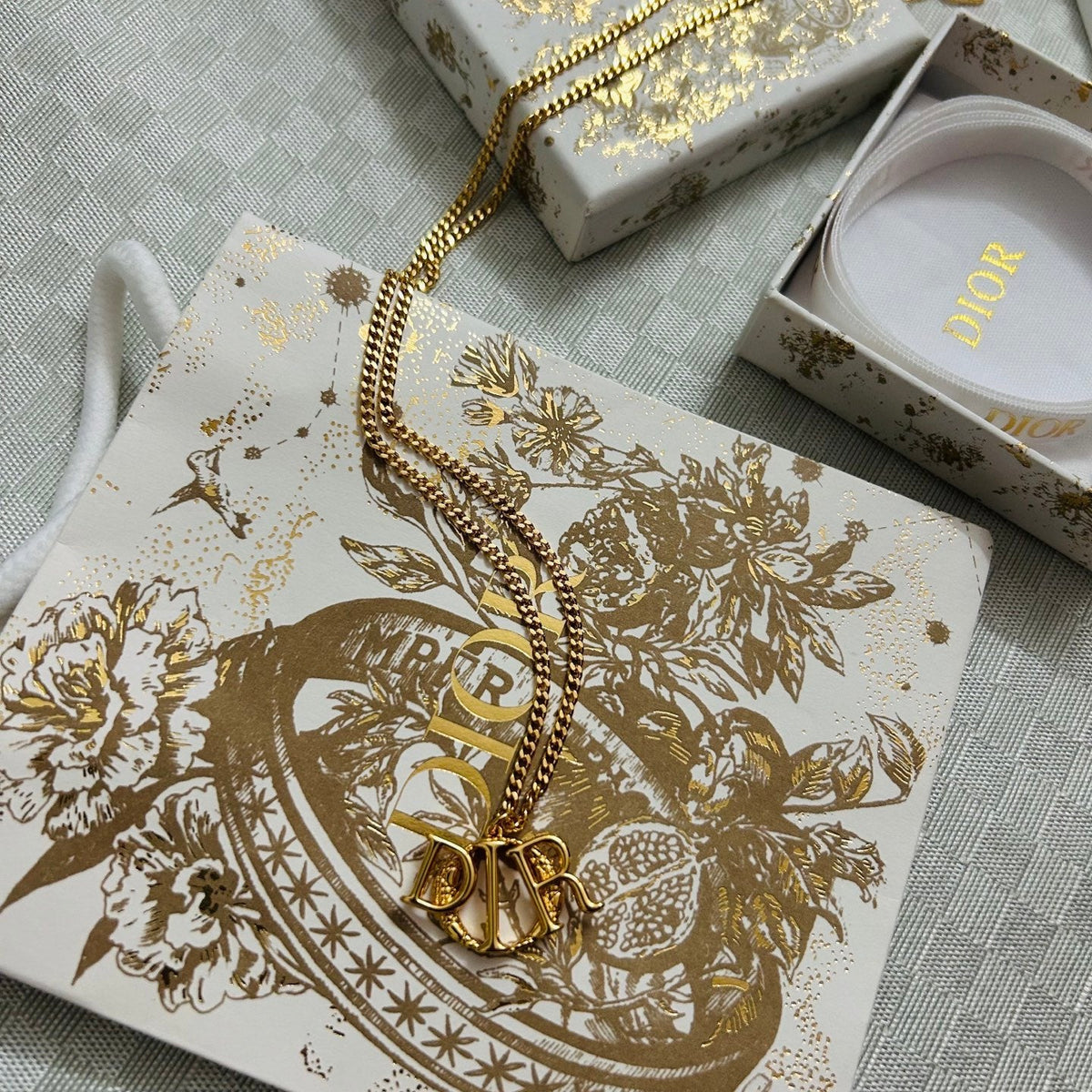 Martin Graham pendant necklace in polished metal-tone – close-up detail