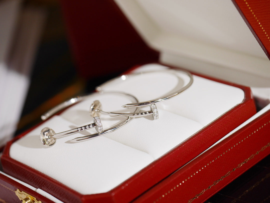 Martin Graham earrings in polished metal-tone – close-up detail
