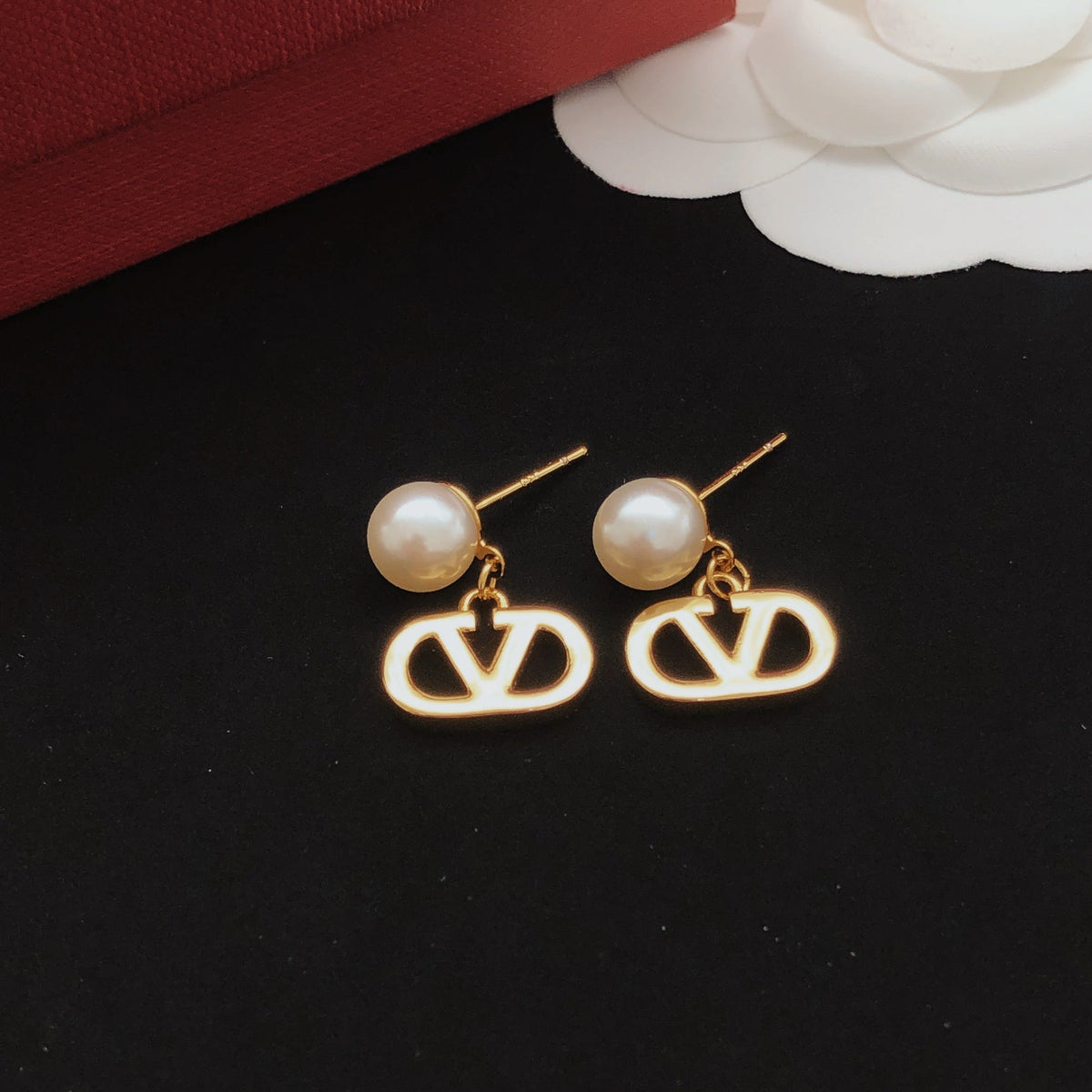 Martin Graham stud earrings in polished metal-tone