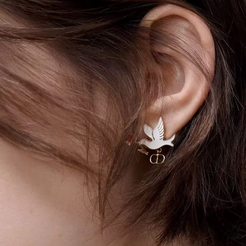 Martin Graham earrings in polished metal-tone – close-up detail