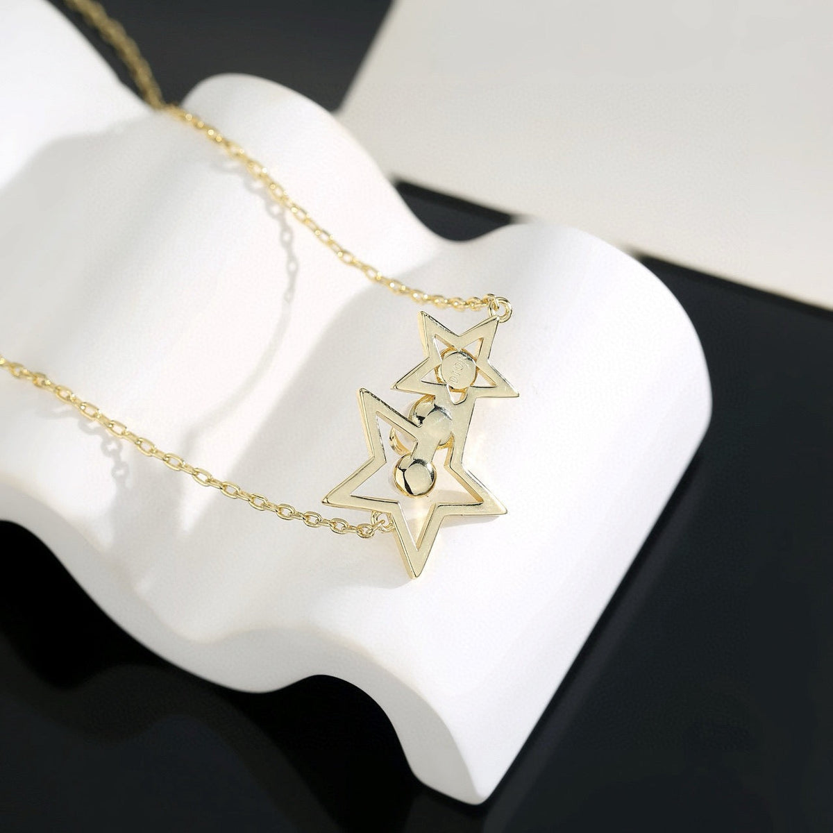 Martin Graham pendant necklace in polished metal-tone – close-up detail