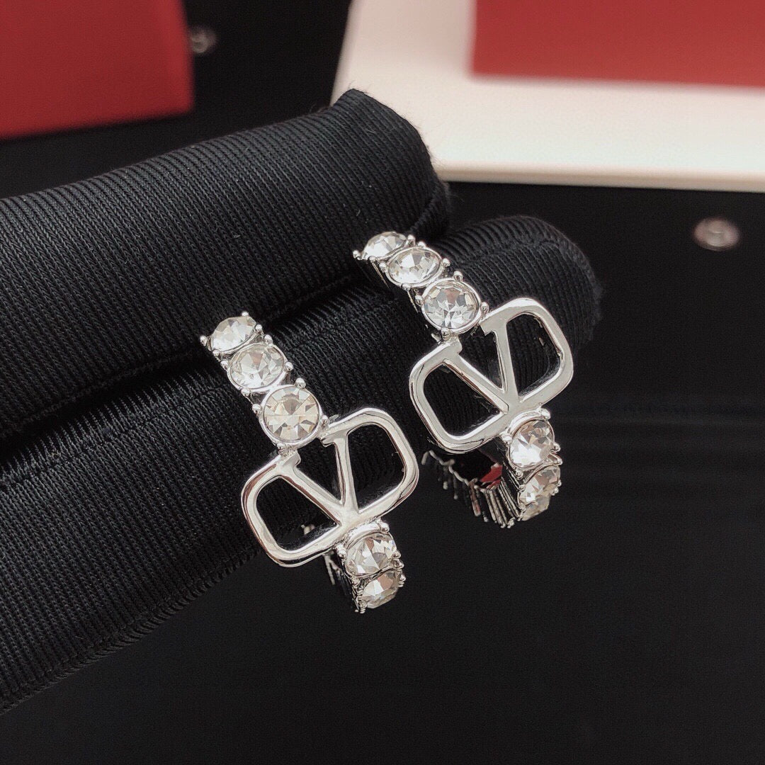 Martin Graham earrings in polished metal-tone