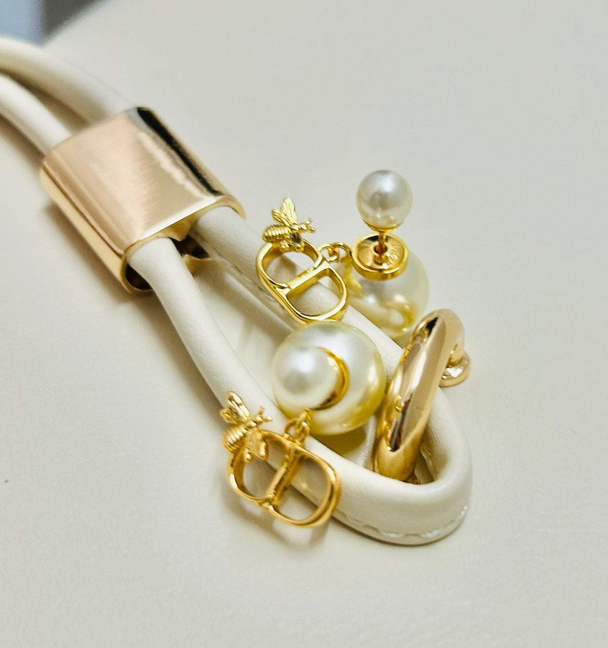 Martin Graham earrings in polished metal-tone – close-up detail