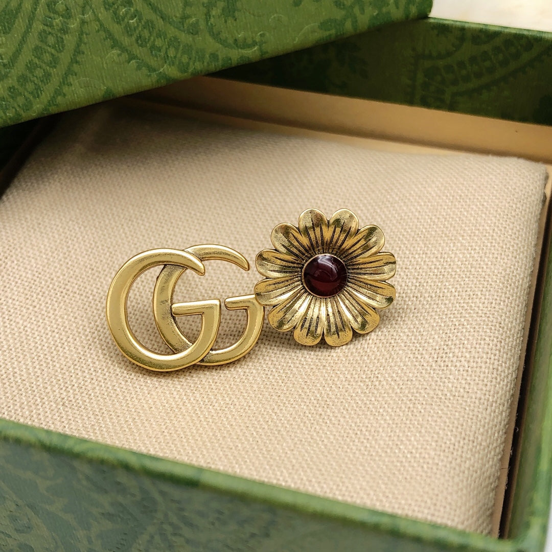 Martin Graham earrings in polished metal-tone – close-up detail