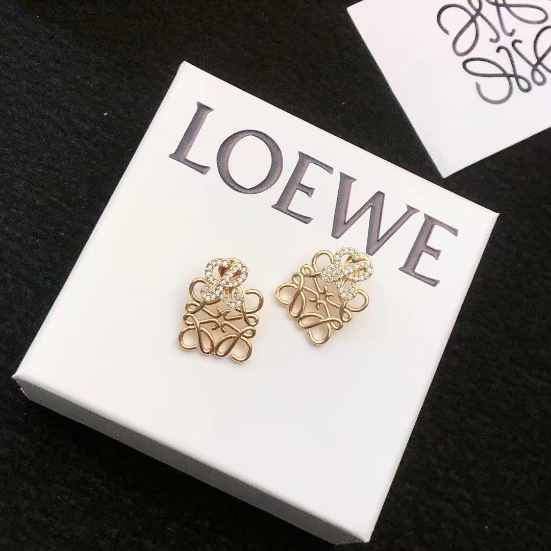 Martin Graham stud earrings in polished metal-tone – close-up detail
