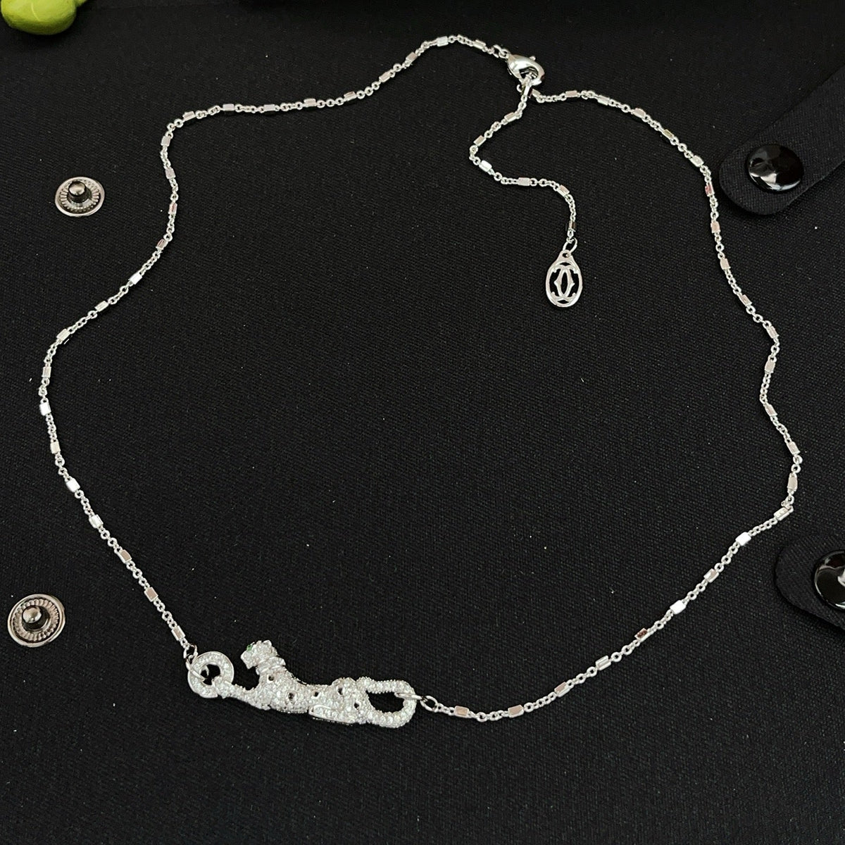 Martin Graham pendant necklace in polished metal-tone – close-up detail