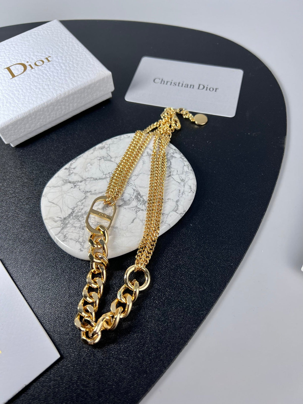 Martin Graham pendant necklace in polished metal-tone – close-up detail
