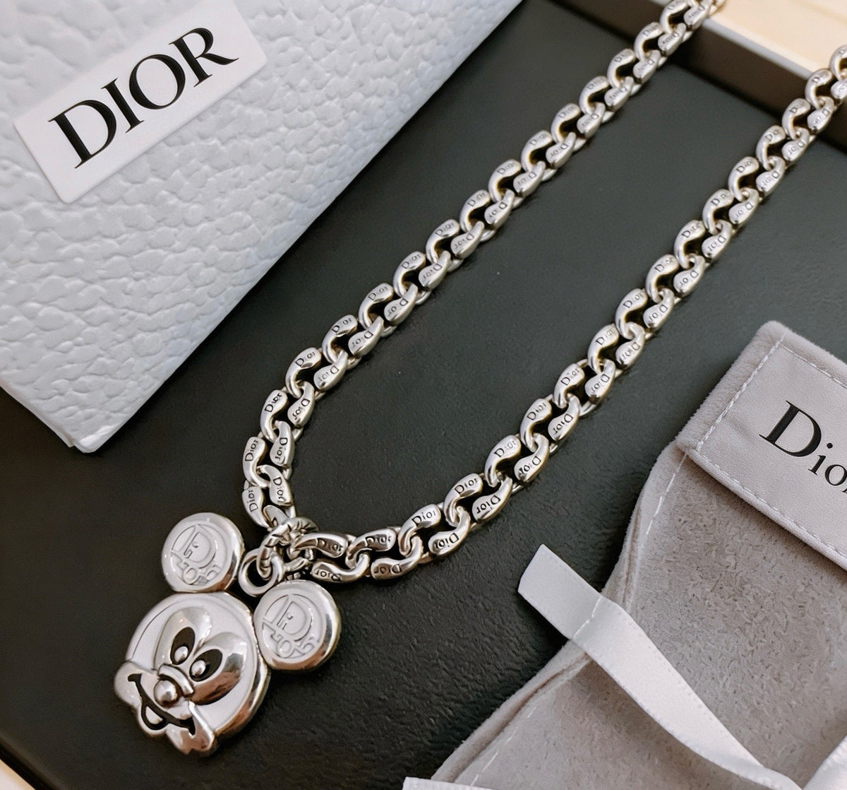 Martin Graham pendant necklace in polished metal-tone – close-up detail