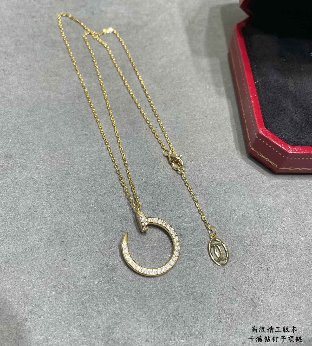 Martin Graham pendant necklace in polished metal-tone – close-up detail