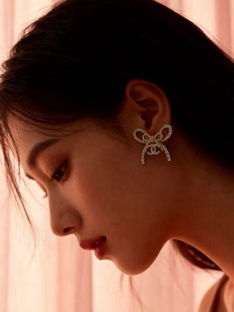 Martin Graham stud earrings in polished metal-tone – styled product view
