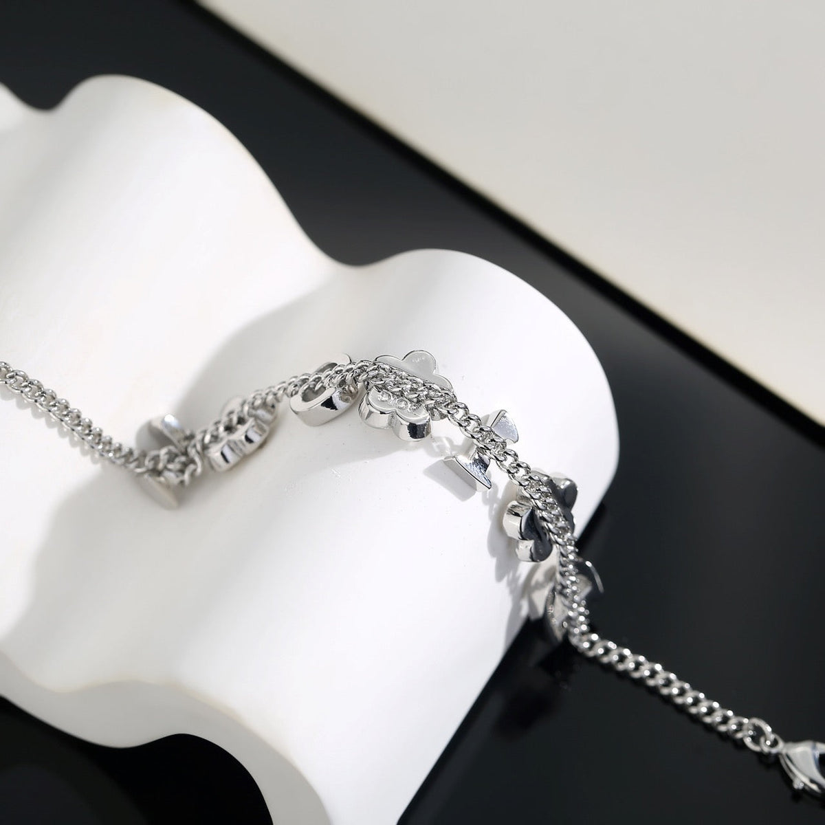 Martin Graham pendant necklace in polished metal-tone – close-up detail