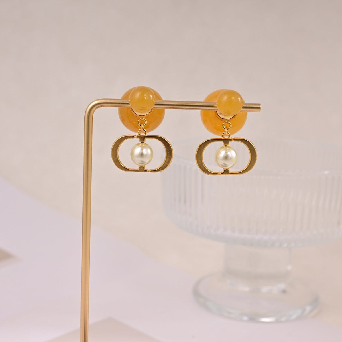 Martin Graham earrings in polished metal-tone – close-up detail