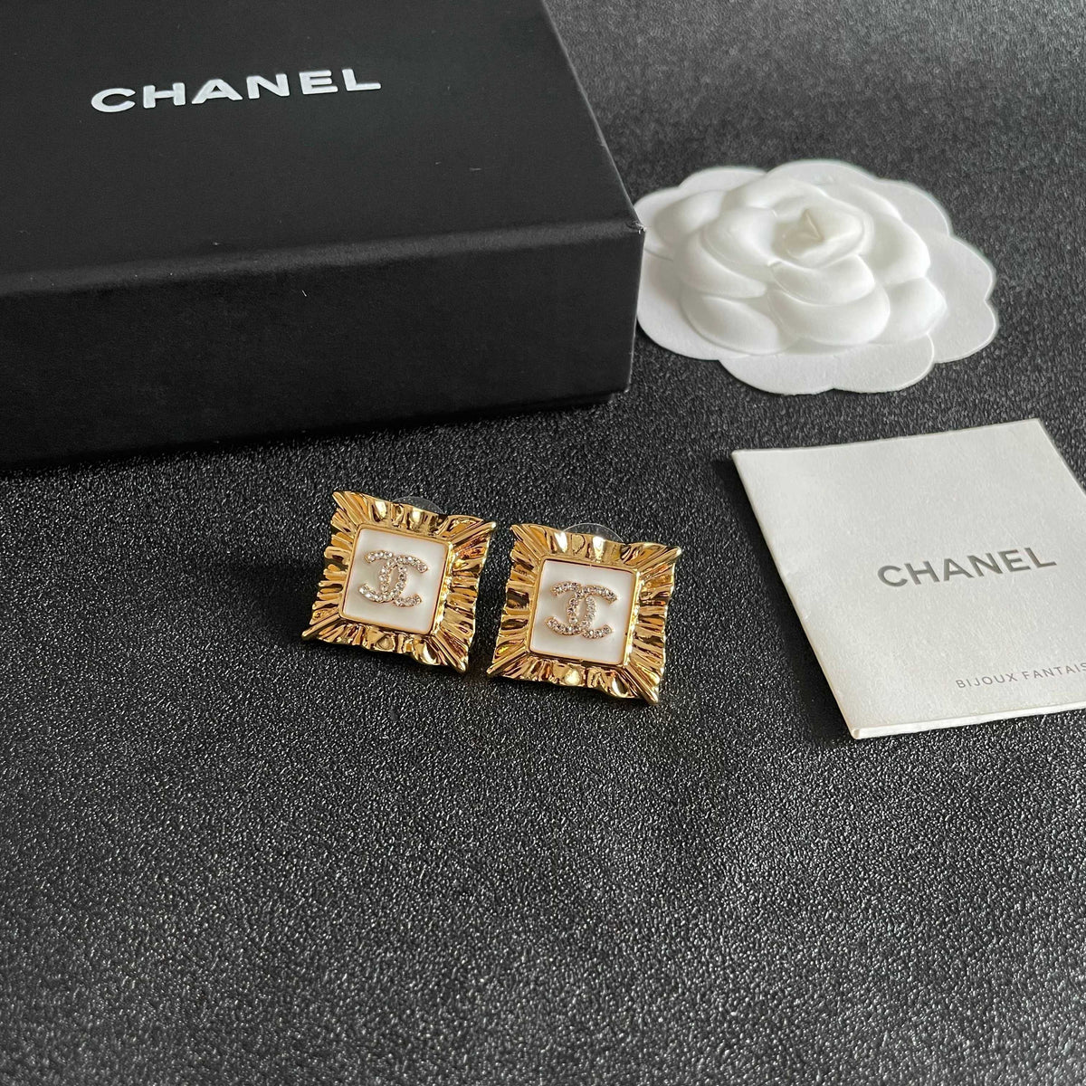 Martin Graham stud earrings in polished metal-tone – styled product view