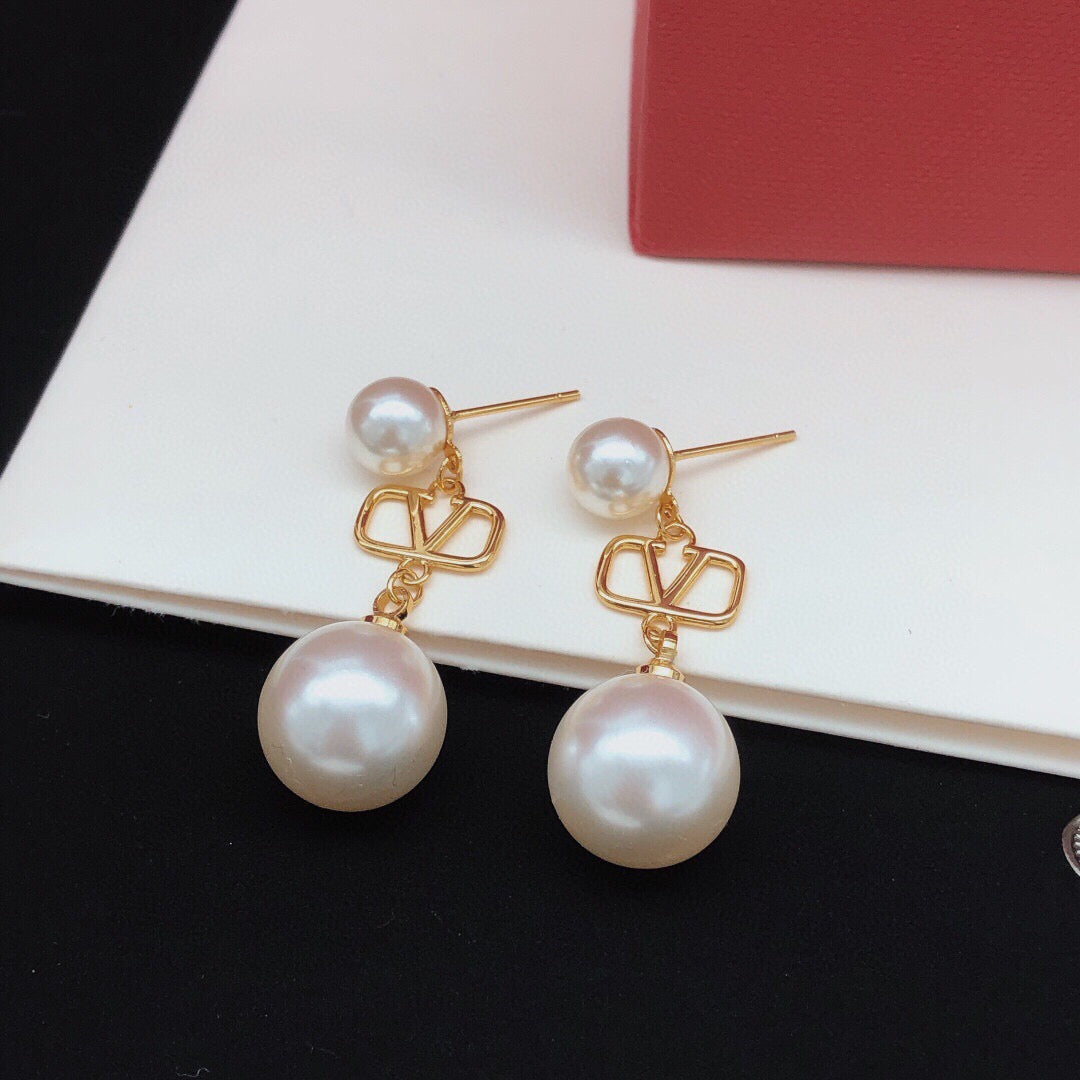 Martin Graham stud earrings in polished metal-tone