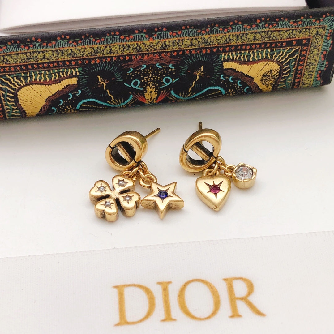 Martin Graham stud earrings in polished metal-tone – close-up detail