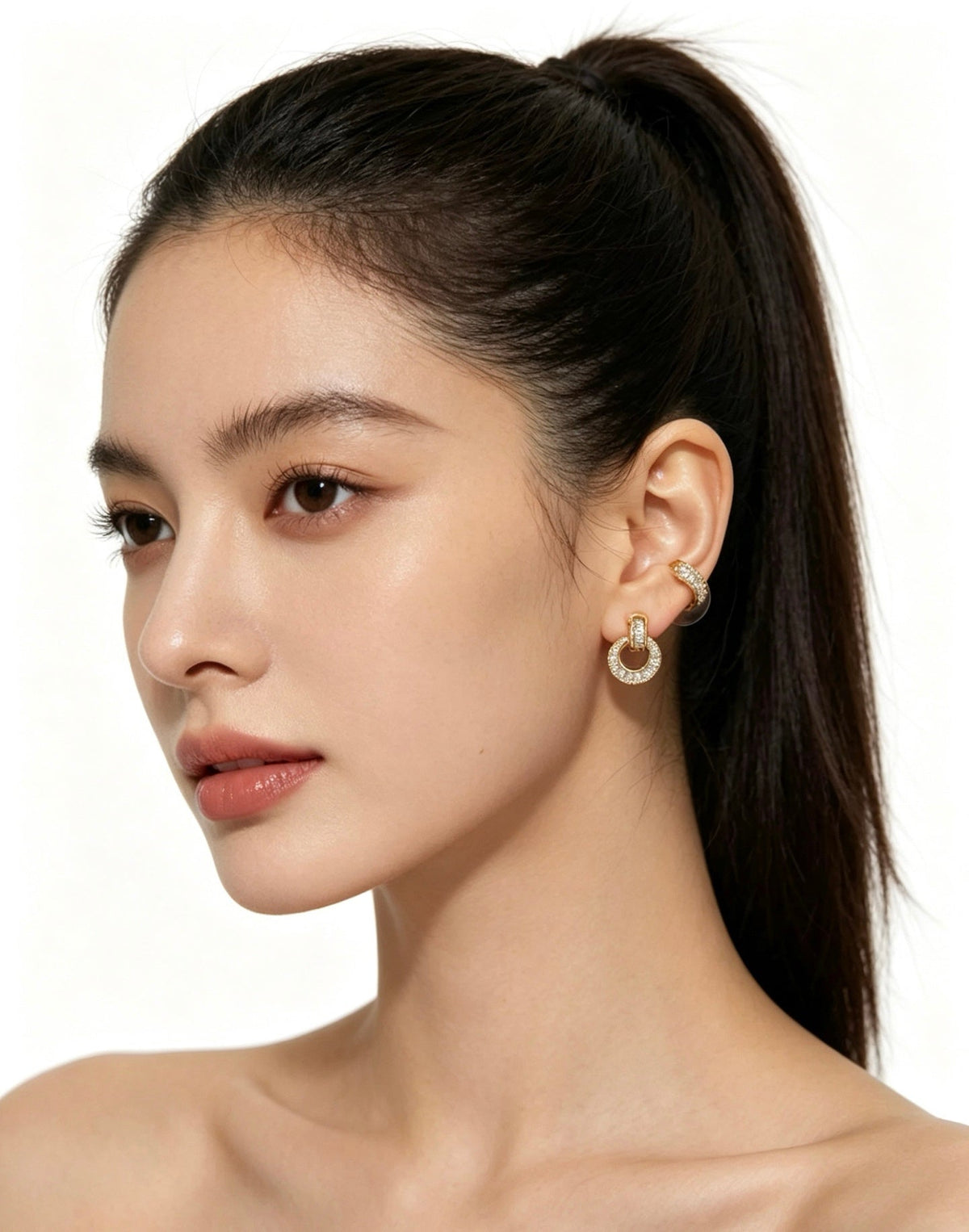 Martin Graham earrings in polished metal-tone – close-up detail