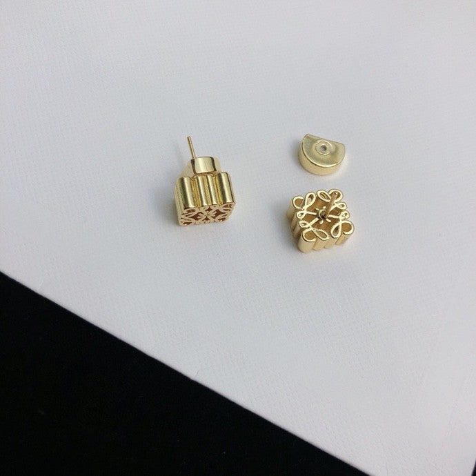 Martin Graham stud earrings in polished metal-tone – close-up detail