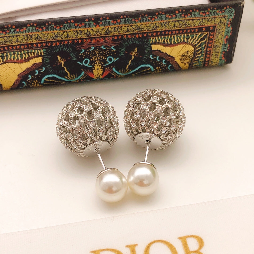 Martin Graham stud earrings in polished metal-tone – close-up detail