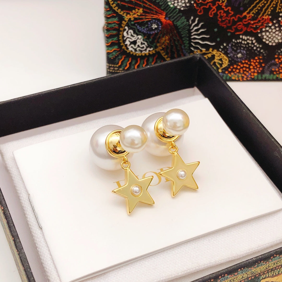 Martin Graham stud earrings in polished metal-tone – close-up detail