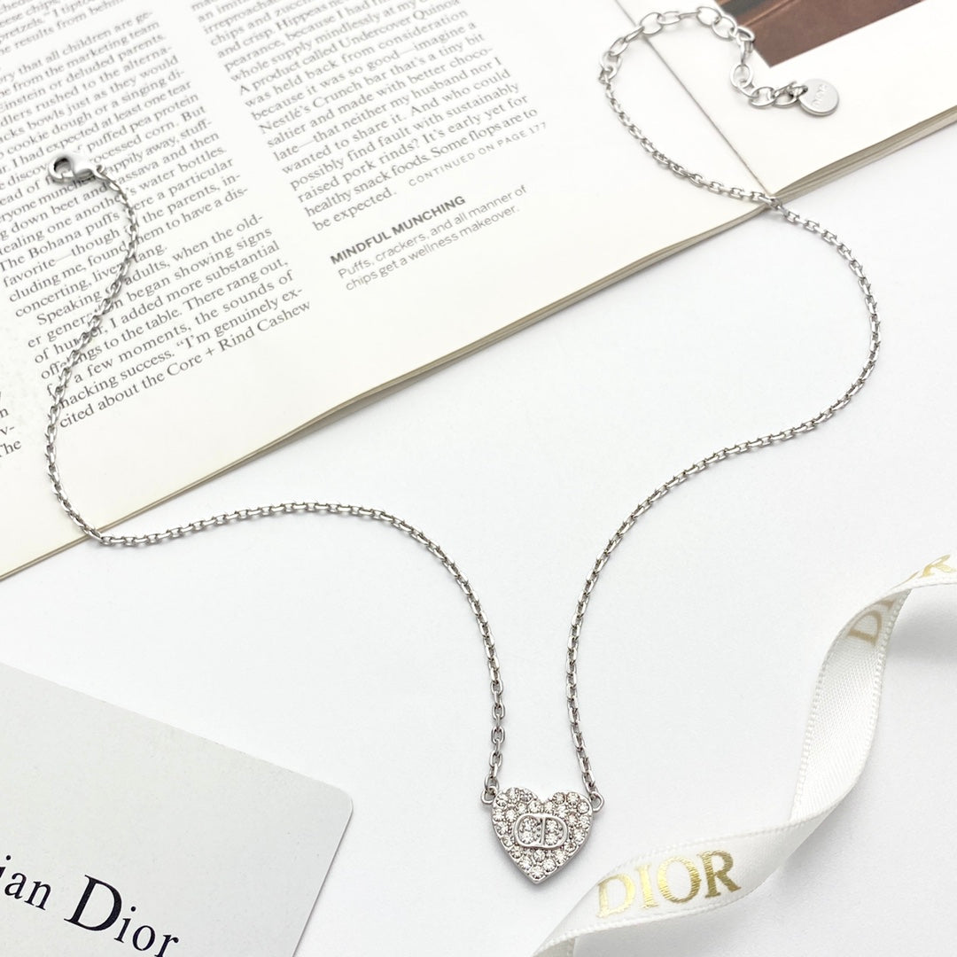 Martin Graham pendant necklace in polished metal-tone – close-up detail
