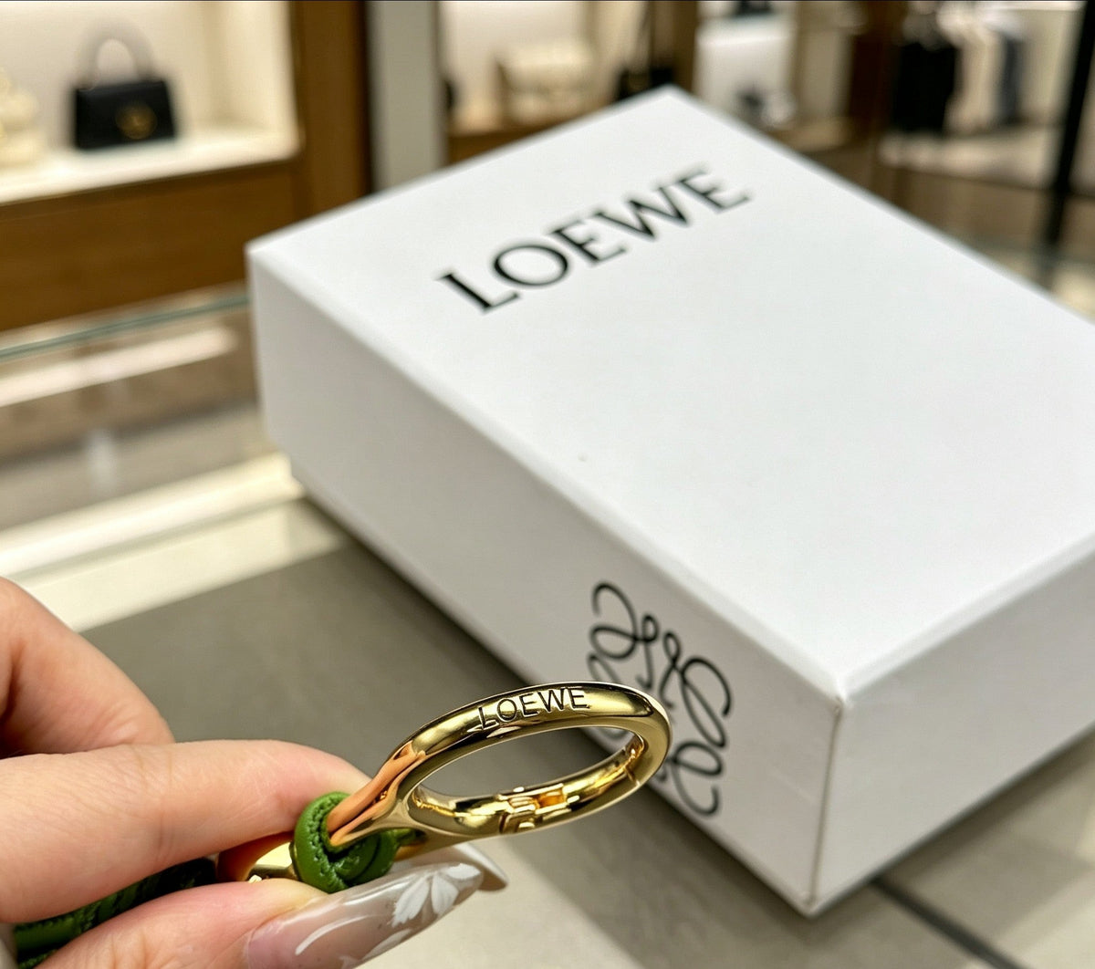 Martin Graham bag charm in polished metal-tone – close-up detail