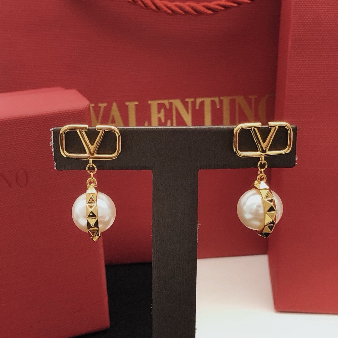 Martin Graham stud earrings in polished metal-tone