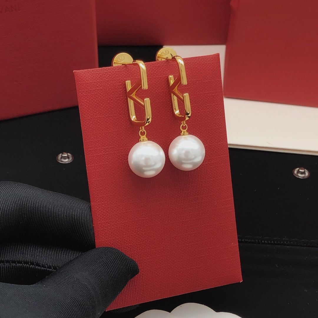 Martin Graham stud earrings in polished metal-tone