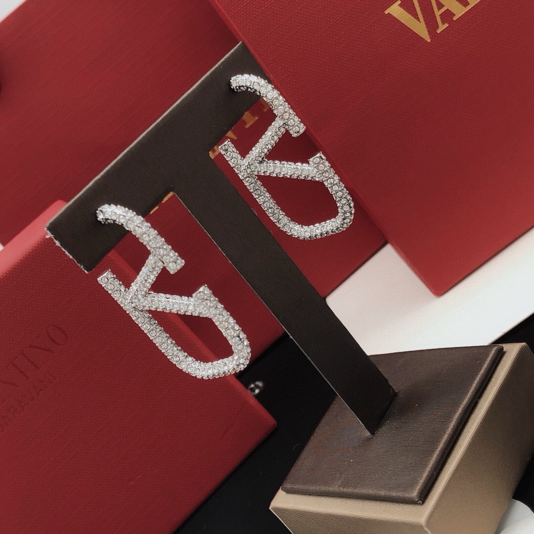 Martin Graham stud earrings in polished metal-tone