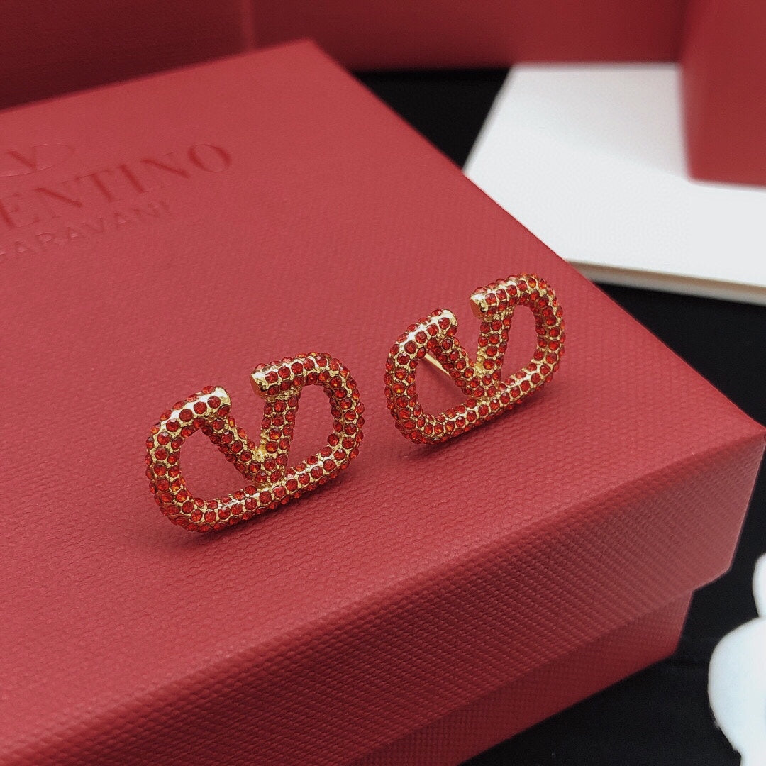 Martin Graham stud earrings in polished metal-tone