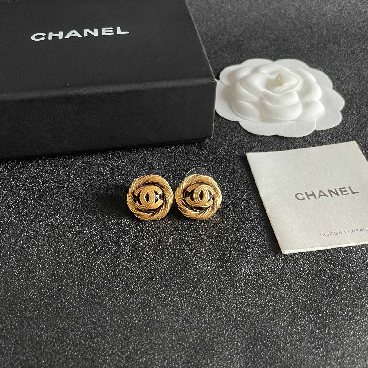 Martin Graham stud earrings in polished metal-tone – styled product view
