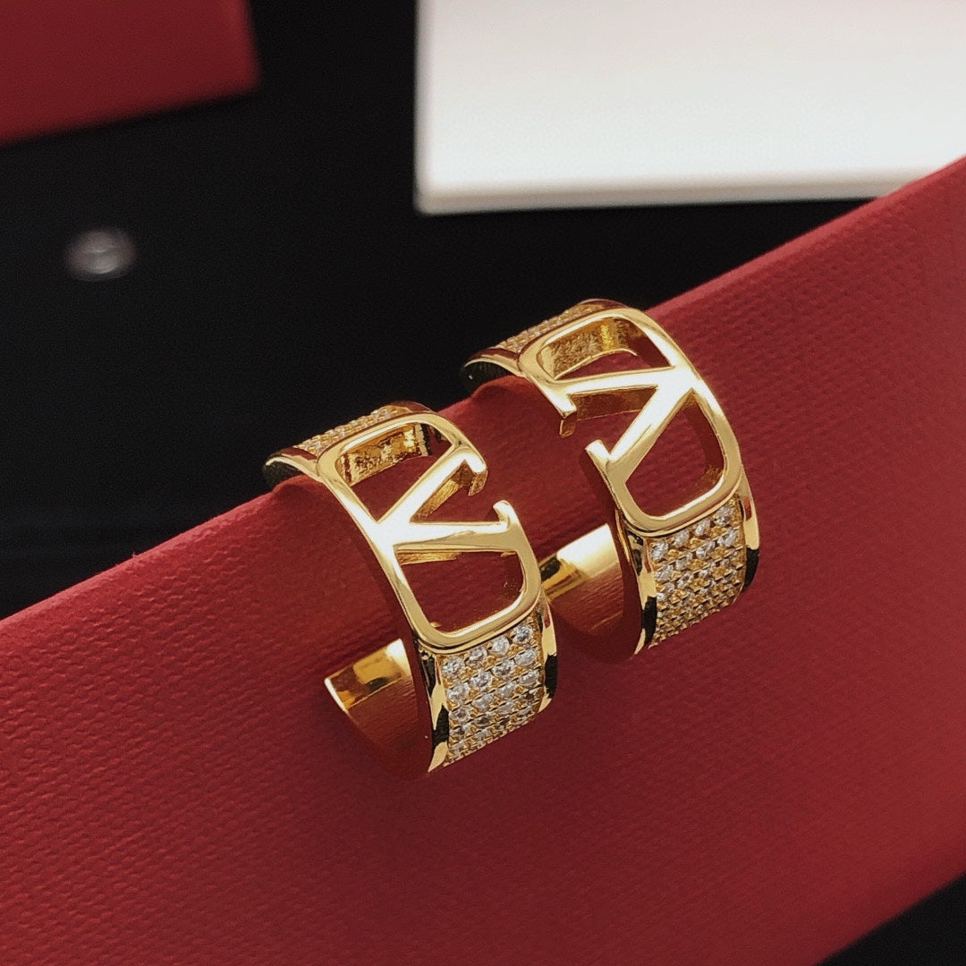 Martin Graham drop earrings in polished metal-tone