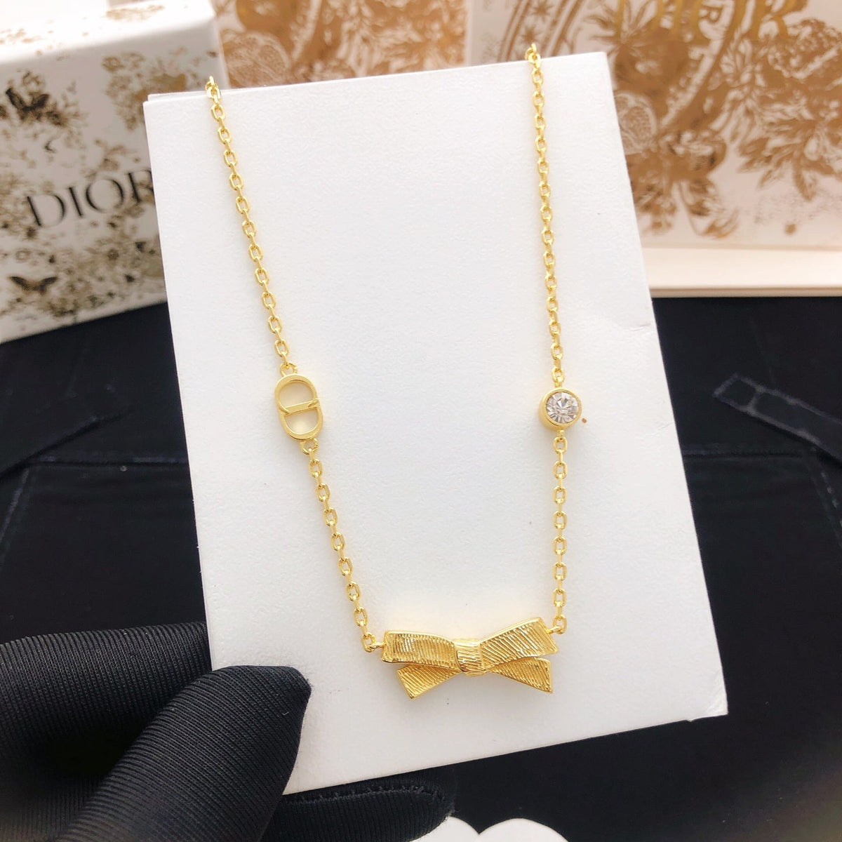 Martin Graham pendant necklace in polished metal-tone – close-up detail