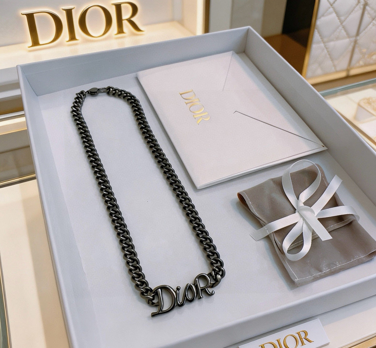 Martin Graham pendant necklace in polished metal-tone – close-up detail