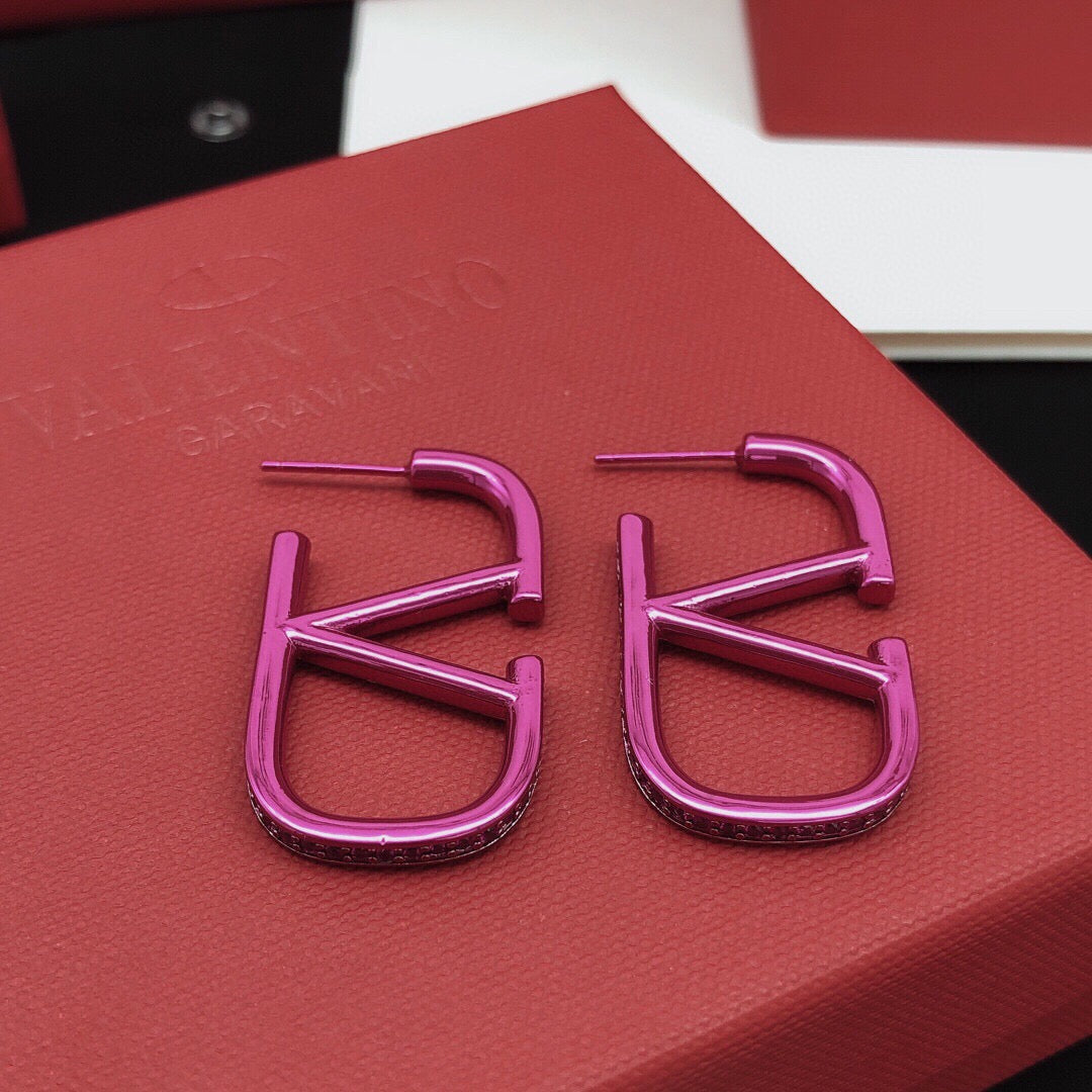 Martin Graham stud earrings in polished metal-tone