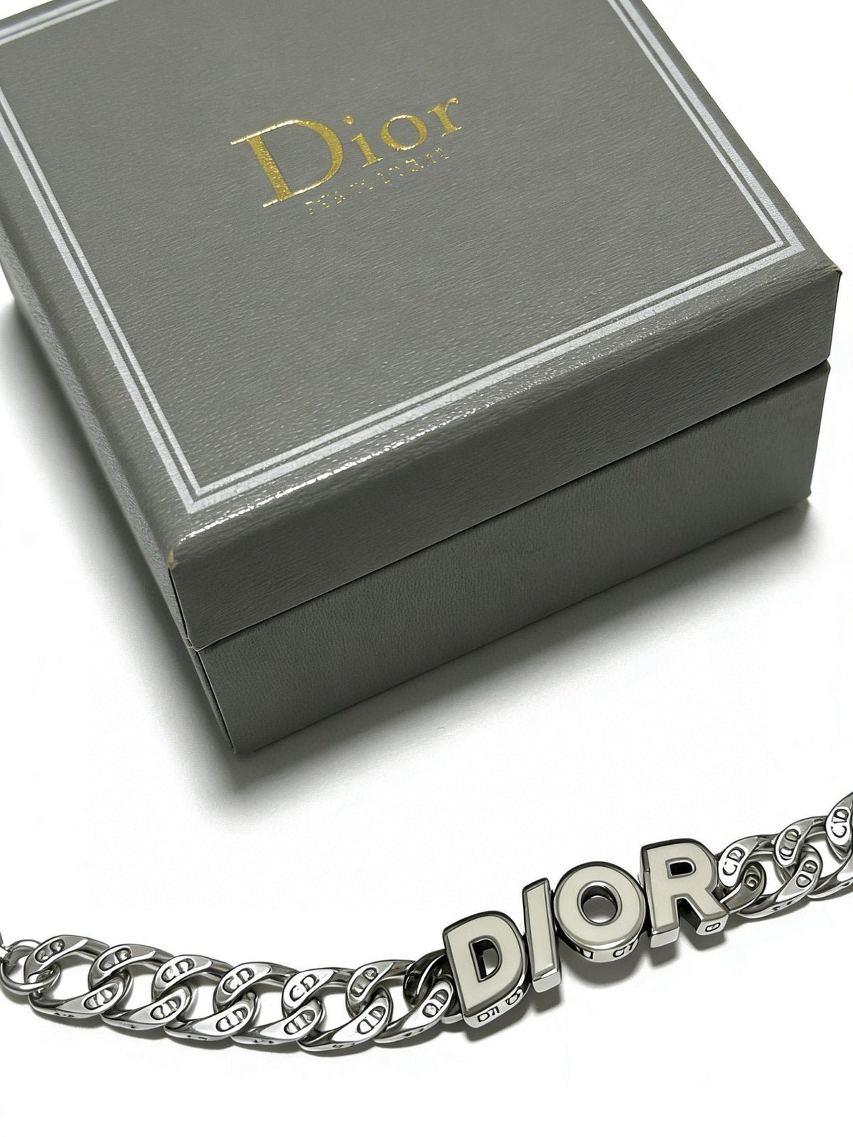 Martin Graham pendant necklace in polished metal-tone – close-up detail