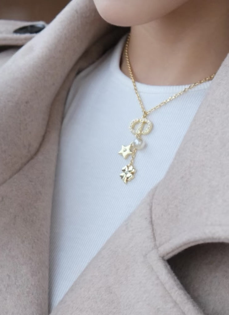 Martin Graham pendant necklace in polished metal-tone – close-up detail