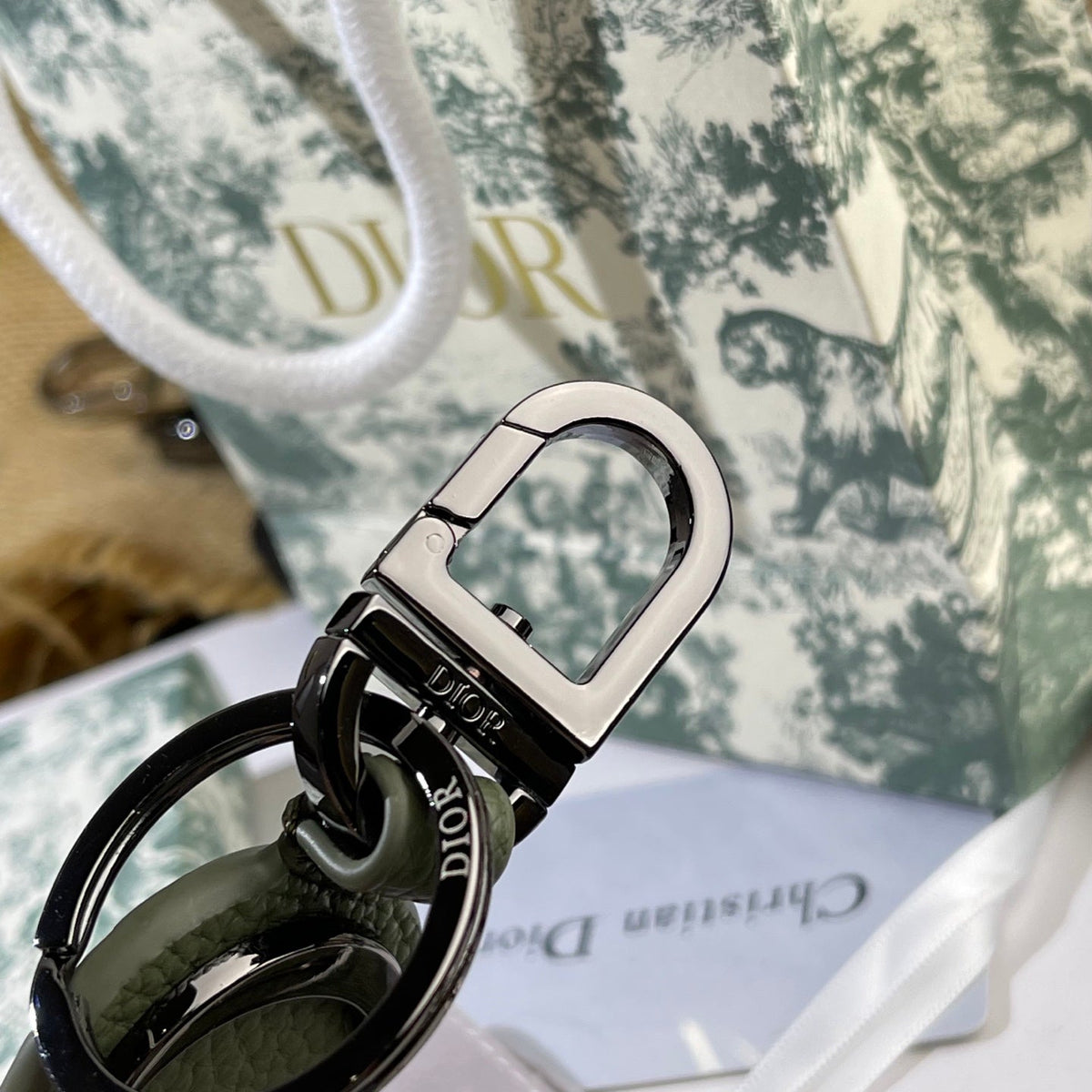 Martin Graham bag charm in polished metal-tone – close-up detail