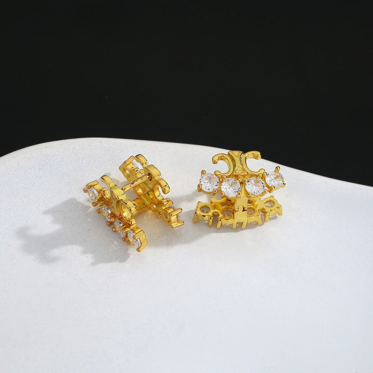 Martin Graham stud earrings in polished metal-tone