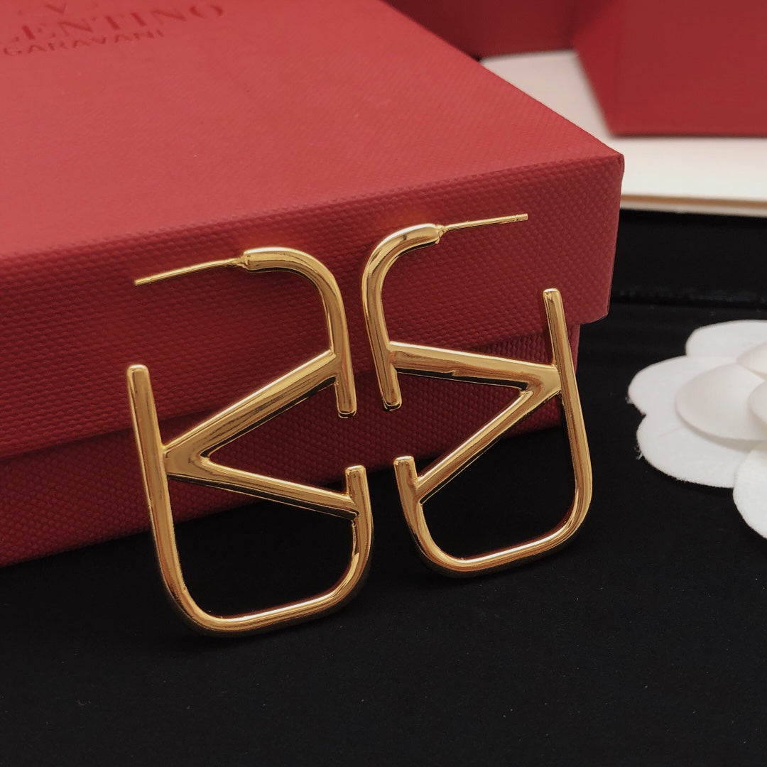 Martin Graham stud earrings in polished metal-tone