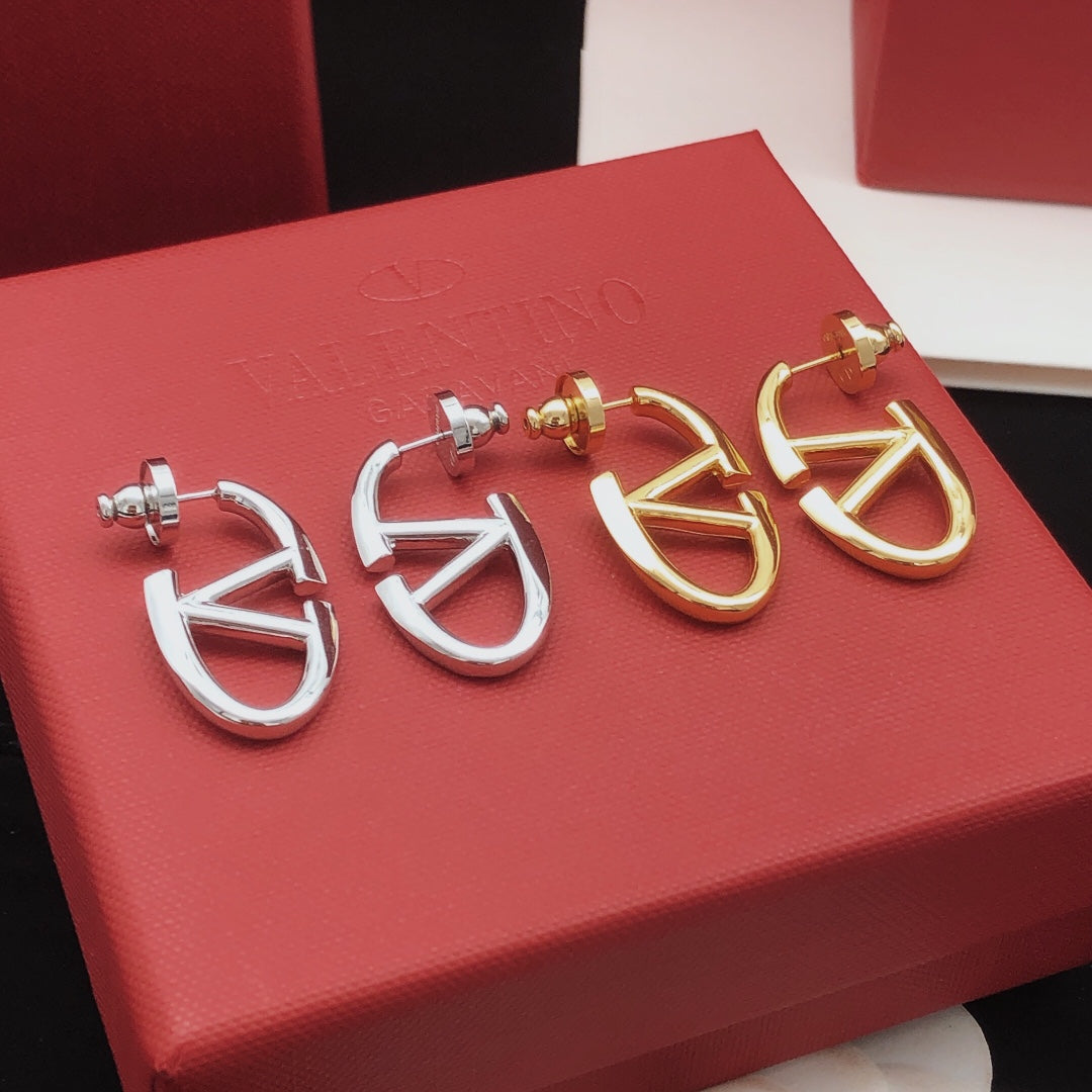 Martin Graham stud earrings in polished metal-tone