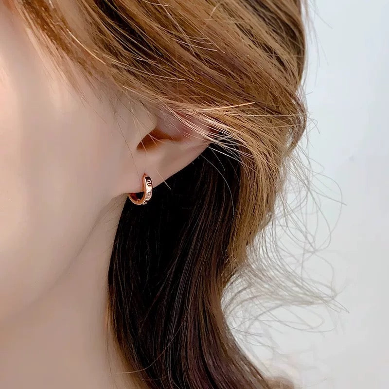 Martin Graham stud earrings in polished metal-tone – main product view