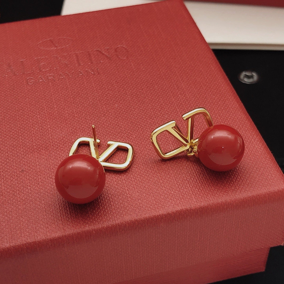 Martin Graham stud earrings in polished metal-tone – main product view