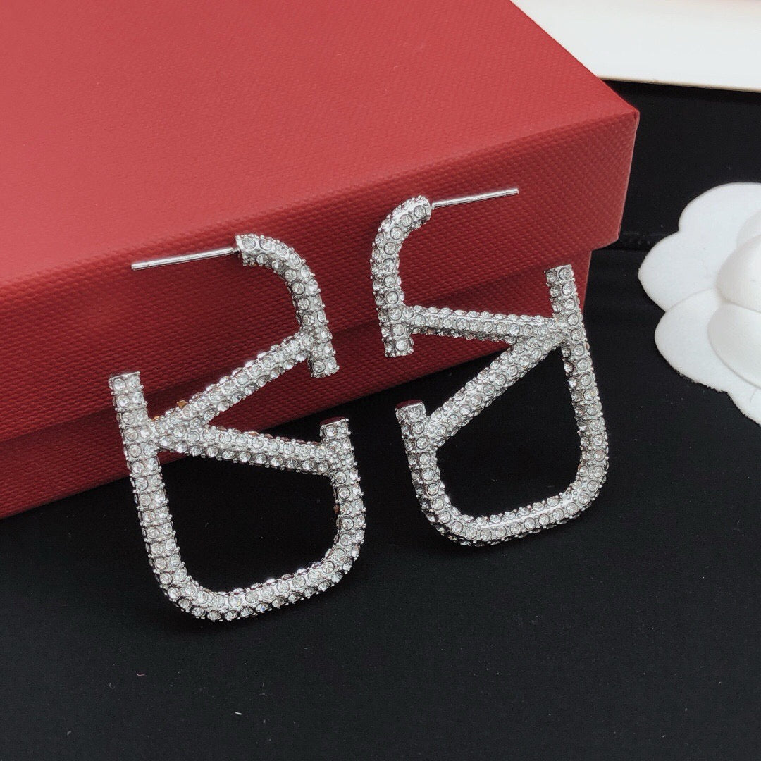 Martin Graham stud earrings in polished metal-tone – main product view