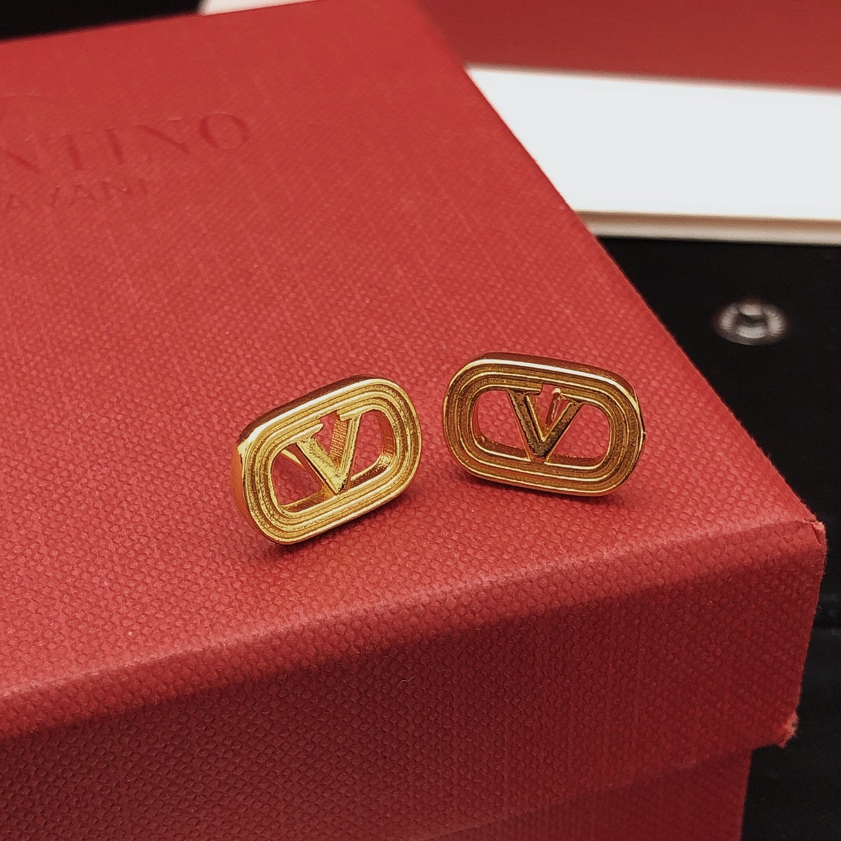 Martin Graham stud earrings in polished metal-tone – main product view