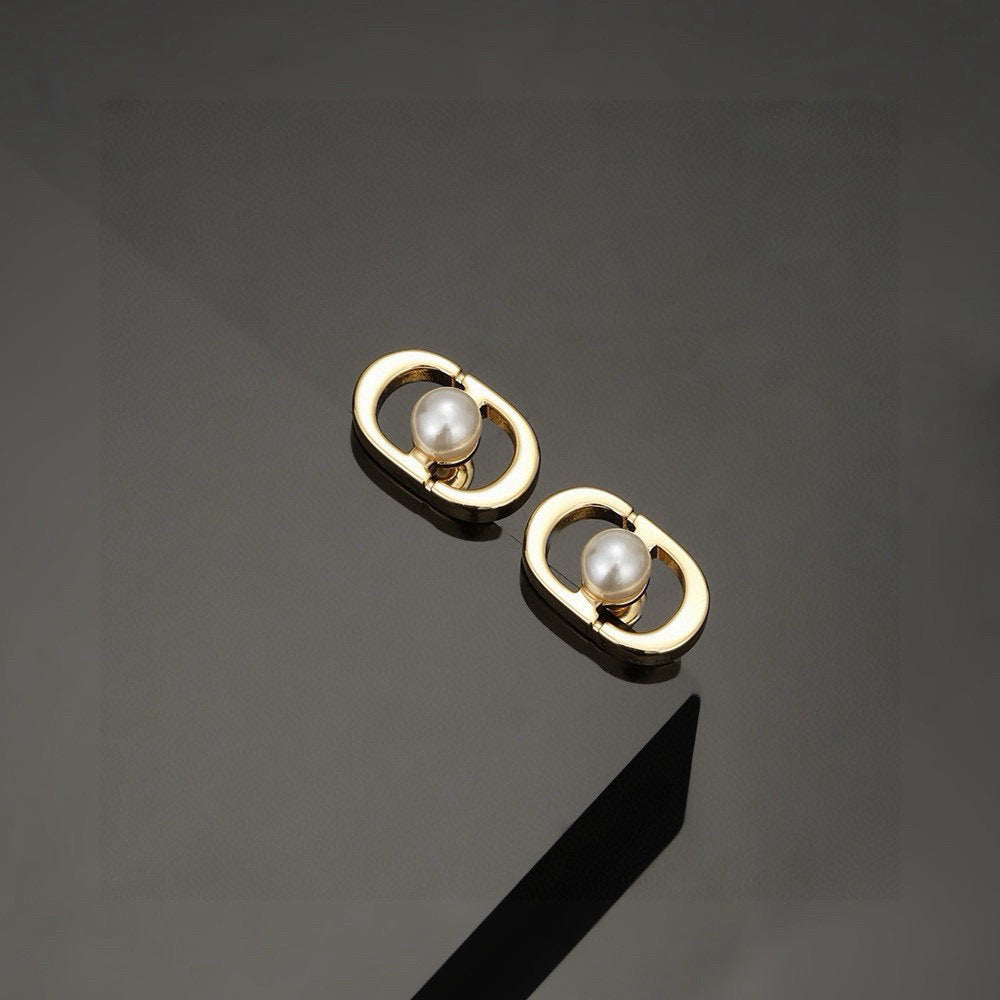 Martin Graham stud earrings in polished metal-tone – main product view