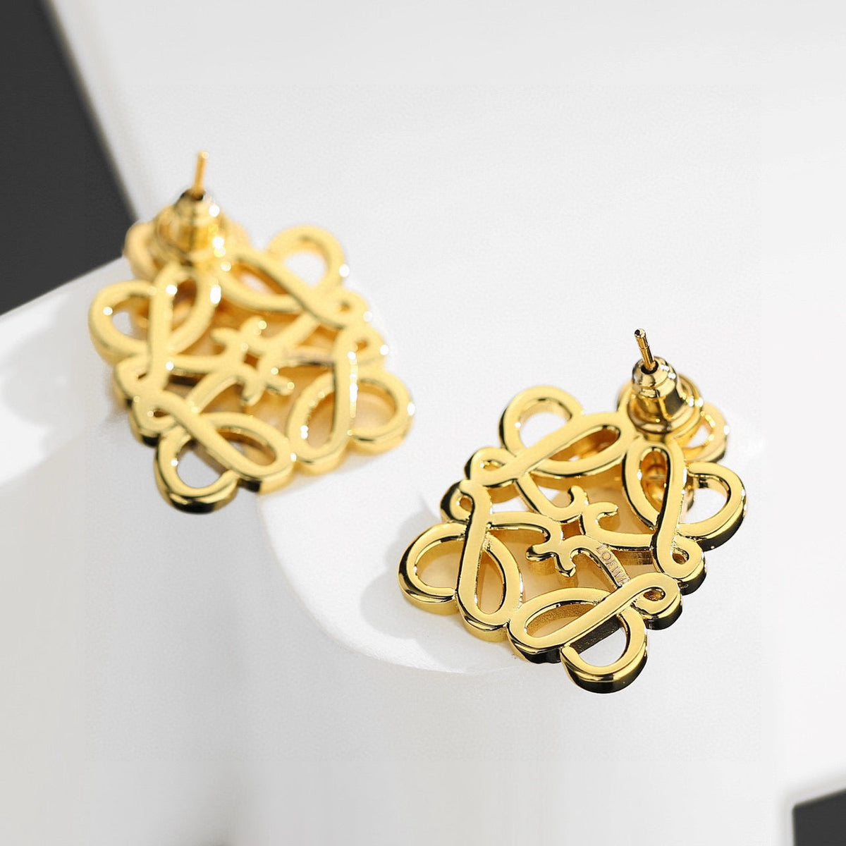 Martin Graham stud earrings in polished metal-tone – main product view