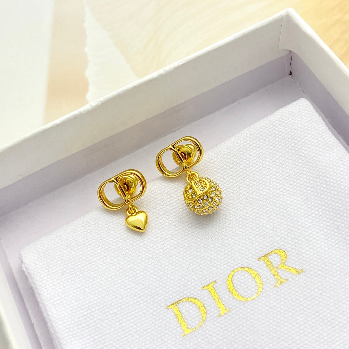 Martin Graham stud earrings in polished metal-tone – main product view