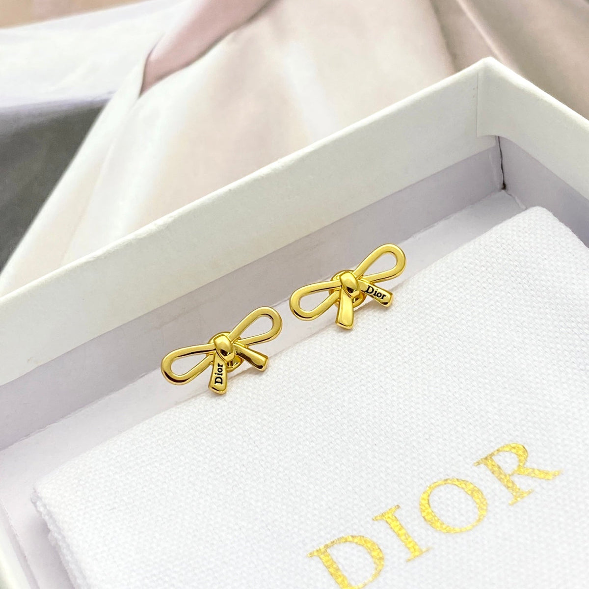 Martin Graham stud earrings in polished metal-tone – main product view